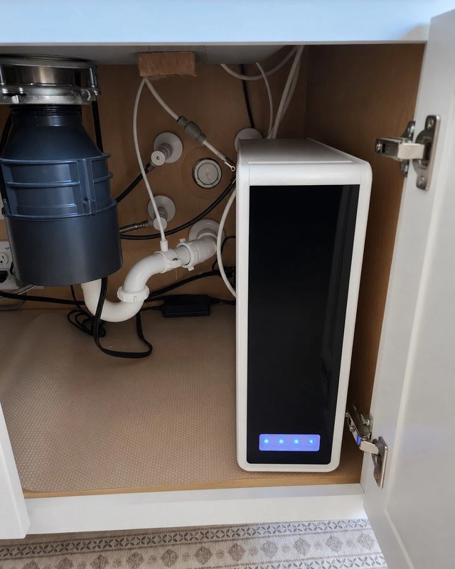 Reverse osmosis system installed under a kitchen sink